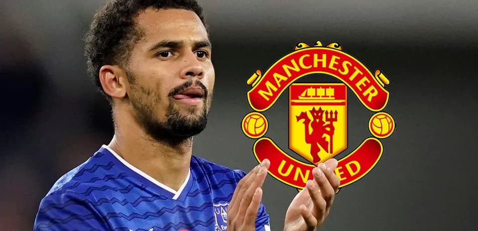 Jugador aplaudiendo con logo de Manchester United de fondo