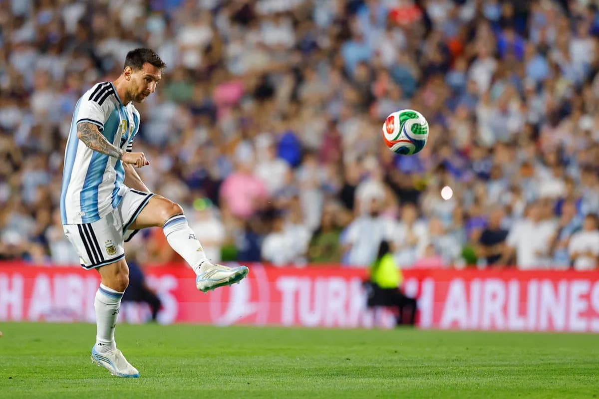 Lionel Messi preparing to kick a soccer ball Lionel Messi preparing to kick a soccer ball